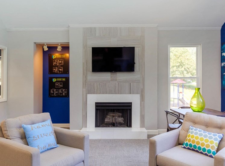 Clubhouse Seating Area Around Fireplace with TV Mounted Above it